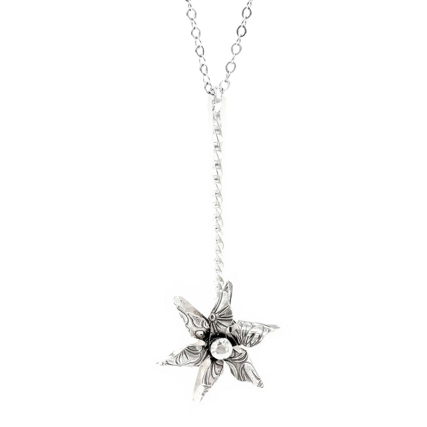 Hand-forged sterling silver pinwheel necklace with spinning pendant. Unique embossed patterns. 24" chain. Playful fidget jewelry for everyday wear.