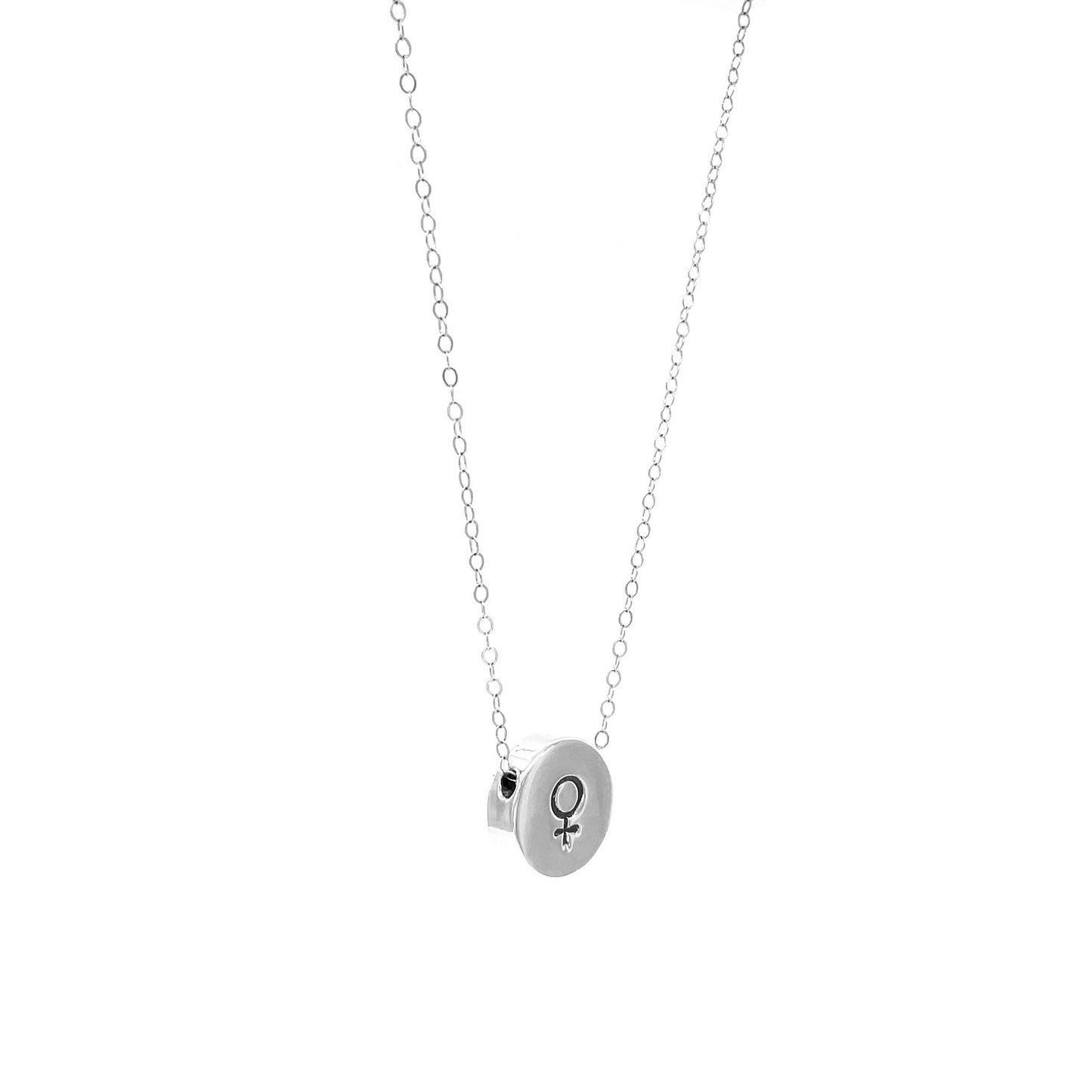 A side angle highlighting the smooth finish and delicate thickness of the hand-stamped Venus charm.