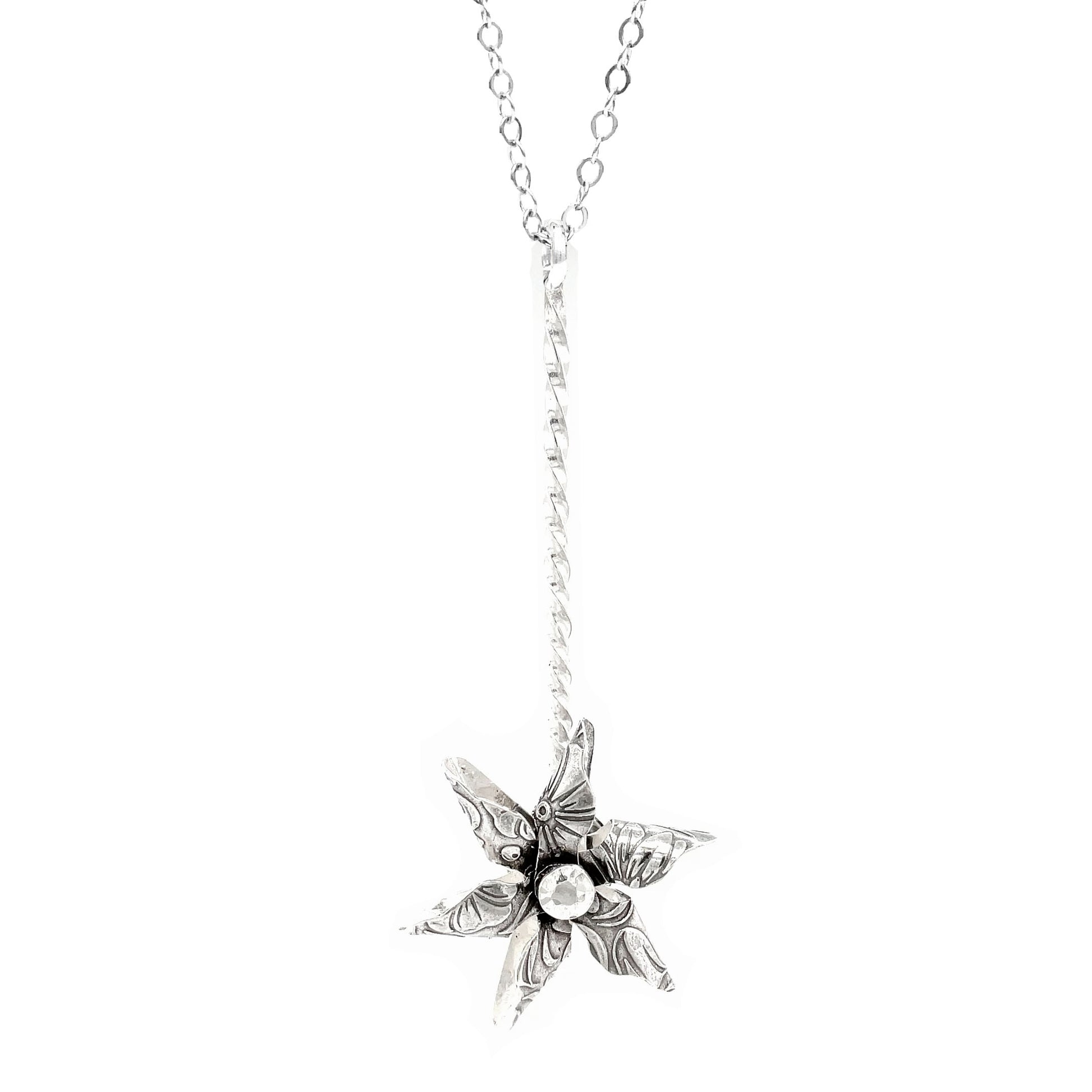 Hand-forged sterling silver pinwheel necklace with spinning pendant. Unique embossed patterns. 24" chain. Playful fidget jewelry for everyday wear.