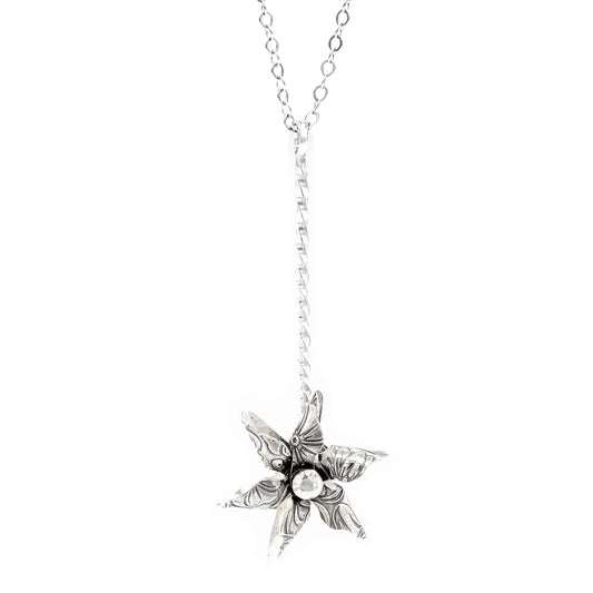 Hand-forged sterling silver pinwheel necklace with spinning pendant. Unique embossed patterns. 24" chain. Playful fidget jewelry for everyday wear.
